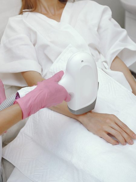 Woman in cosmetology studio on laser hair removal